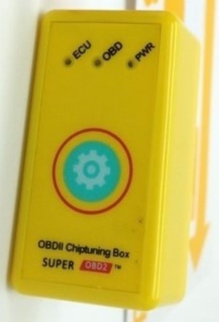 Close up of a ChipPower OBD2 tuning box, a plug-and-play device often marketed for performance enhancement but commonly found to be ineffective.