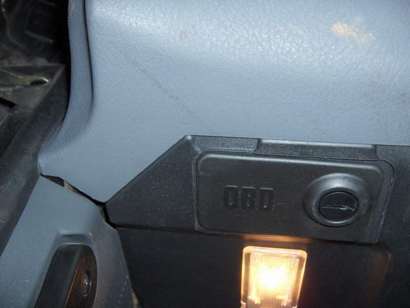 BMW OBD port under dash with cover