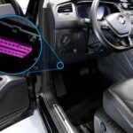 Diagram showing the location of the OBDII port under the dashboard of a vehicle