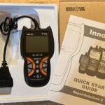 Innova 6030P OBD2 Scanner: A close-up view of the handheld car diagnostic tool.