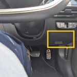 Accessing the Kia EV6 OBD2 Port: Location under the dashboard on the right-hand side, easily accessible for diagnostic tools and EV monitoring.