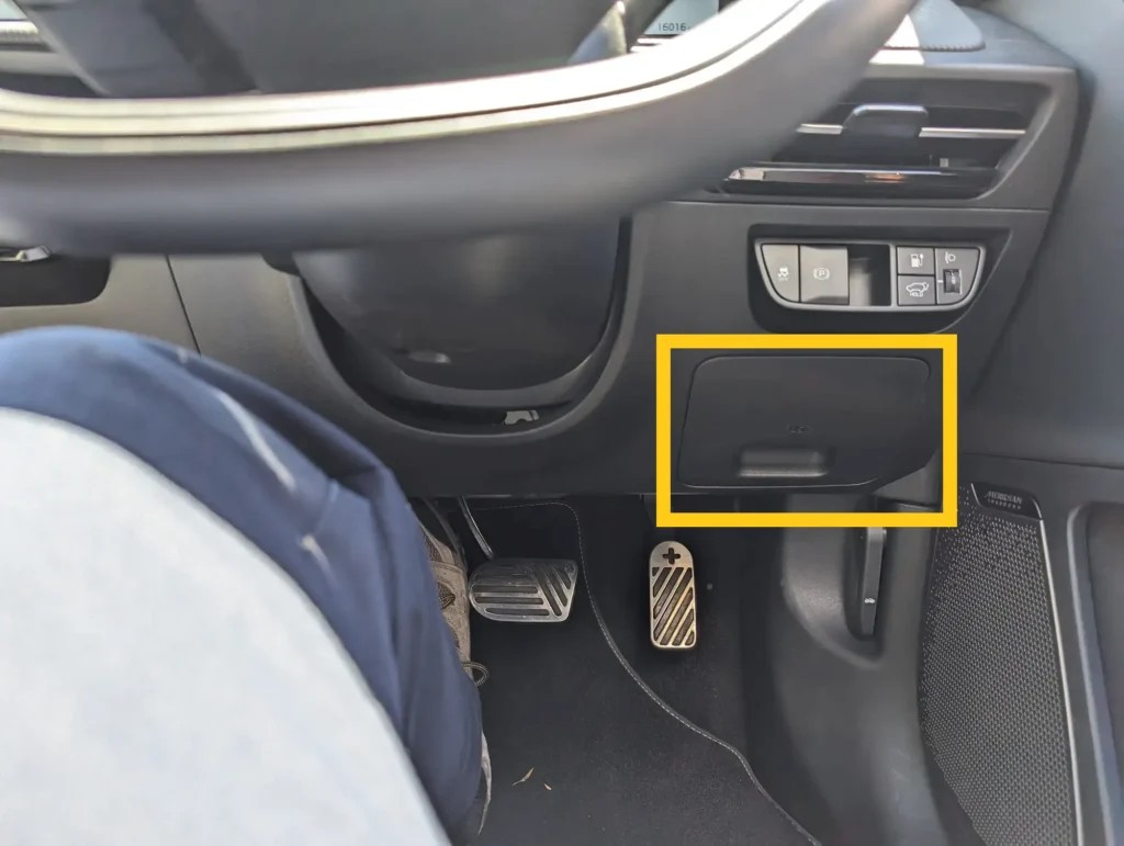 Accessing the Kia EV6 OBD2 Port: Location under the dashboard on the right-hand side, easily accessible for diagnostic tools and EV monitoring.