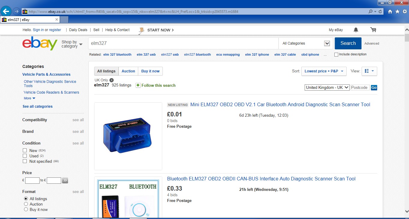 Close-up of an ELM327 OBD2 reader, a diagnostic tool for cars, highlighting its compact design and connector pins.