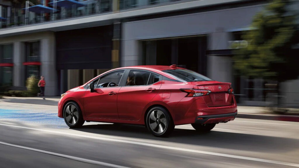 Red 2024 Nissan Versa Sedan