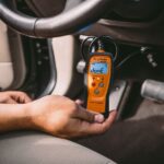 OBD2 scanner displaying "DONE" after reading car trouble codes at AutoZone